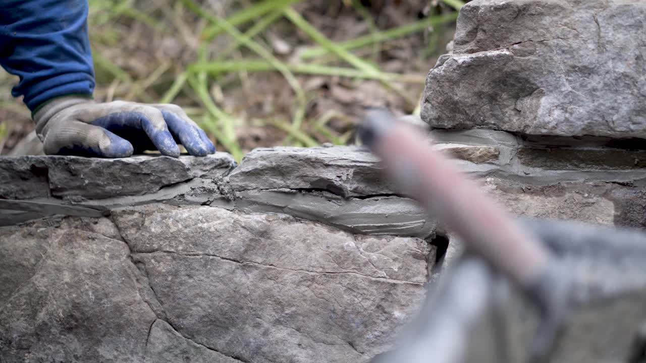 Repairing a Stone Wall with Mortar