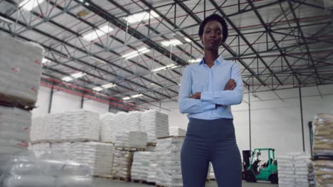 portrait of young female manager in a warehouse