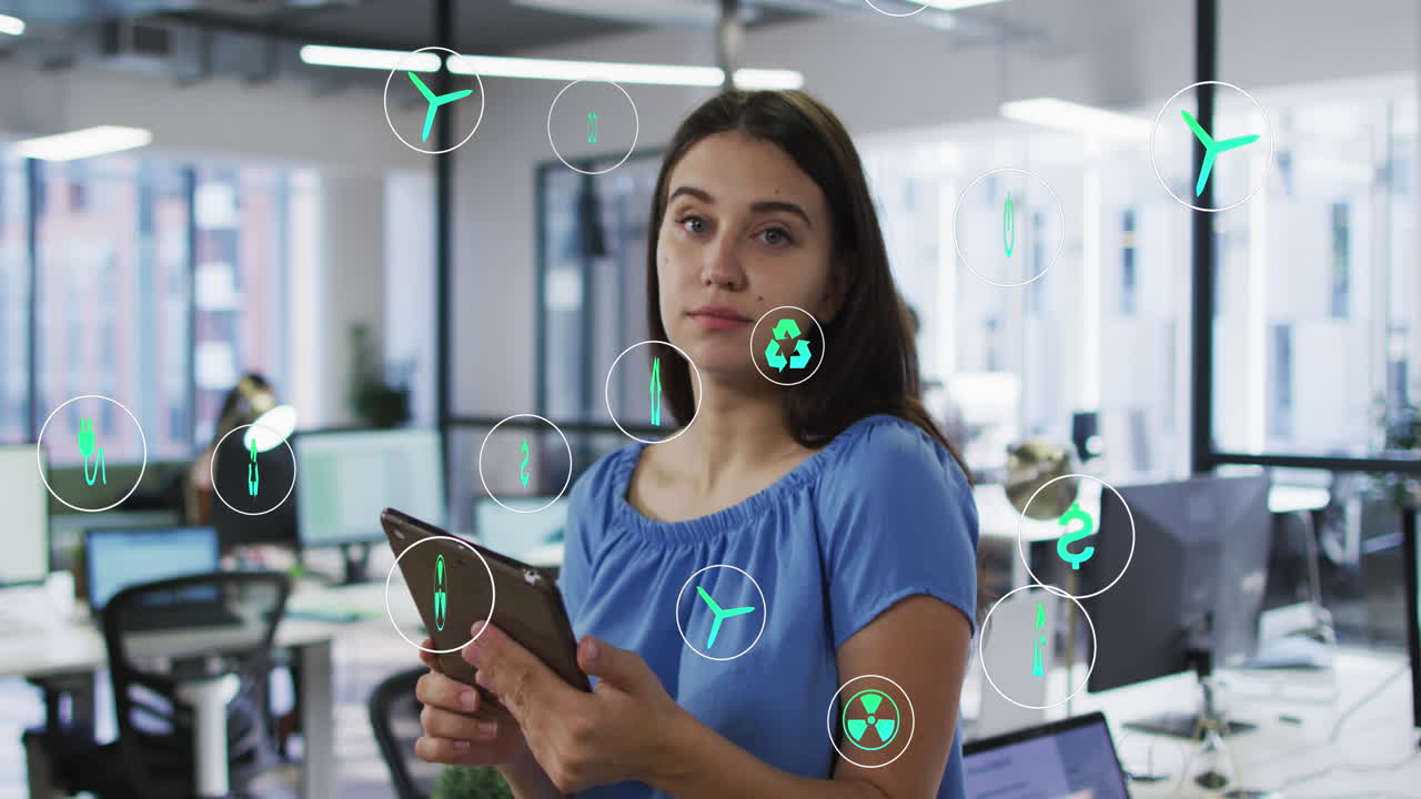 animación de iconos sobre una mujer de negocios caucásica usando una tableta en la oficina