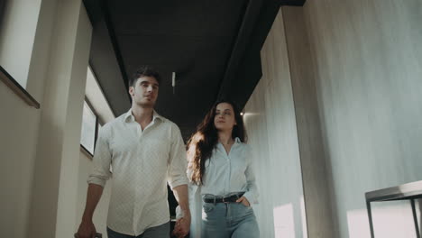 loving couple heading to hotel room