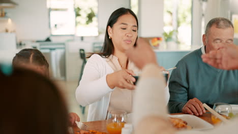 big family, dinner table and dishing food