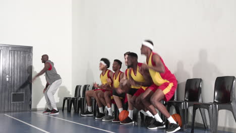 basketball team celebrating victory on court, players cheering with excitement