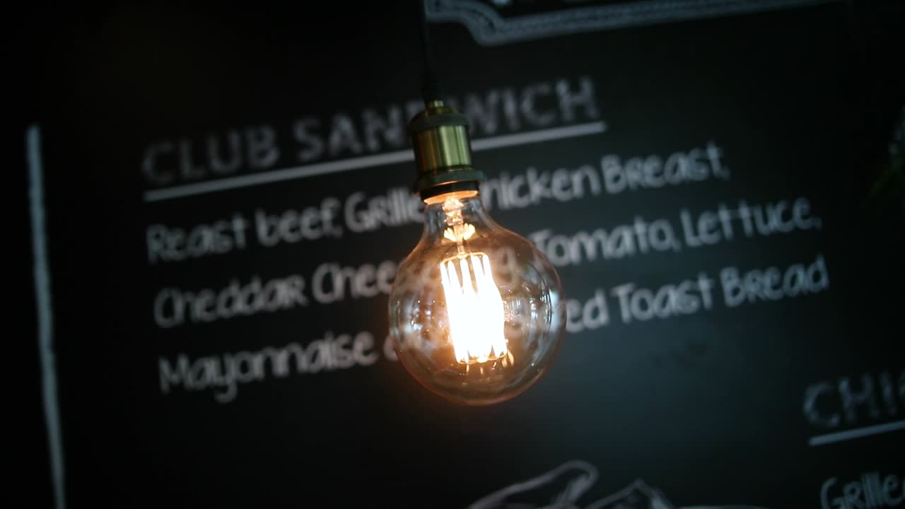 zoom out footage of a lightbulb in cafeteria
