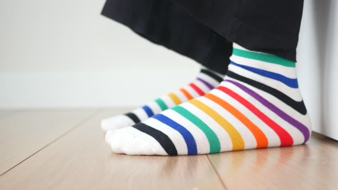 Colorful Striped Socks on Wooden Floor