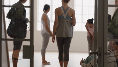 healthy-group-of-women-in-yoga-class-enjoying-conversation-sharing-lifestyle-discussing-fitness-practice-chatting-in-studio