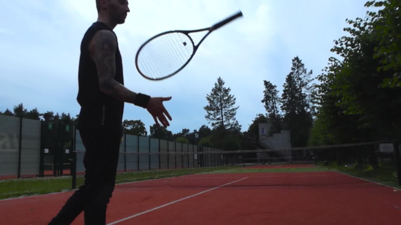 Tennis Player with Racket on an Outdoor Court