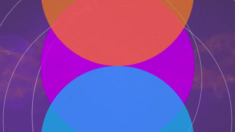 animación de círculos azules, rosados y amarillos que se mueven sobre un fondo violeta