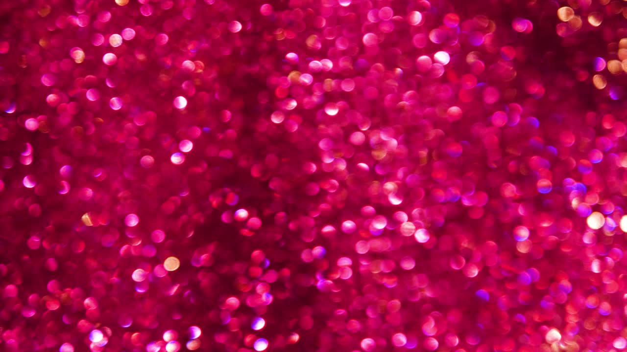 brillante brillo rosa y fondo brillante. resolución de 4k. fondo de brillo rosa con textura brillante. luz brillante de rubí, estrellas chispas de pañuelos y brillo brillante fondo de papel de aluminio