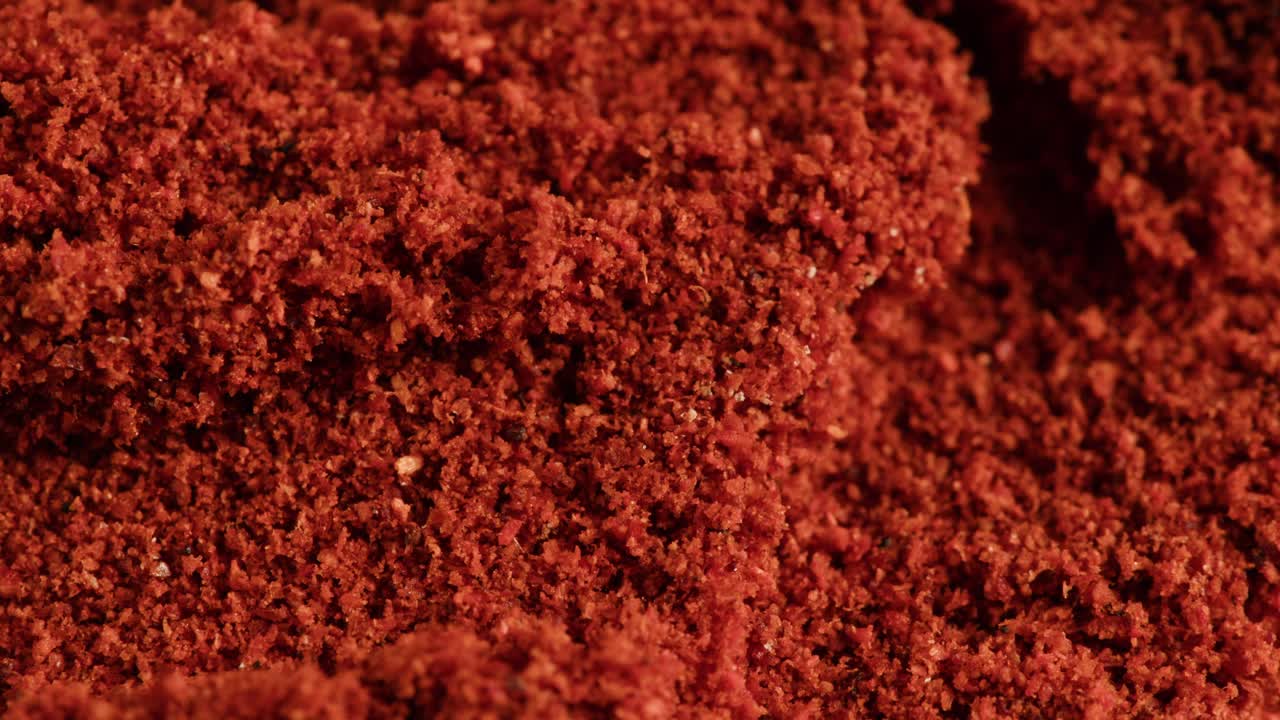 Close-up Macro Shot of Vibrant Red Paprika Powder