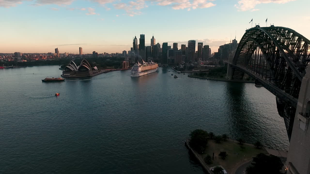 Aerial View Of Iconic Sydney Harbour At Dusk, City Skyline In Distance