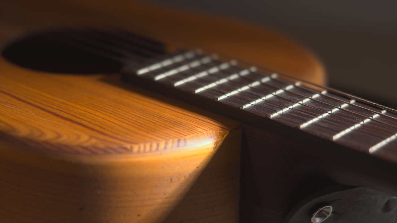 Closeup Fretboard Meeting Guitar Body With Illuminated Frets Strings And Warm Wood Finish Creating Intimate . Media