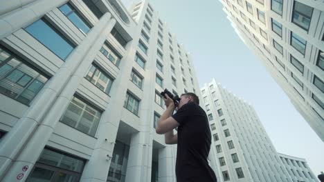 photographer taking pictures of modern buildings