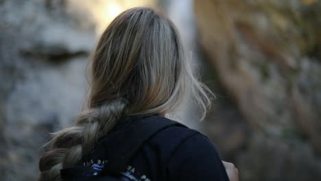 Slow-Motion-Shot-of-a-beautiful-blonde-female-hiking-and-climbing-up-a-trail-in-the-Wasatch-Mountains-in-Utah