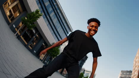 joyful young man dancing and expressing energy in an urban setting