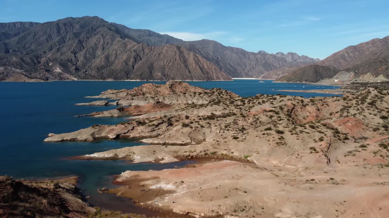 Aerial view of Potrerillos Reservoir toward hydro dam in Argentina