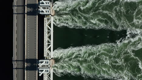 water flowing on weir of delta projects netherlands near kamperland in zeeland