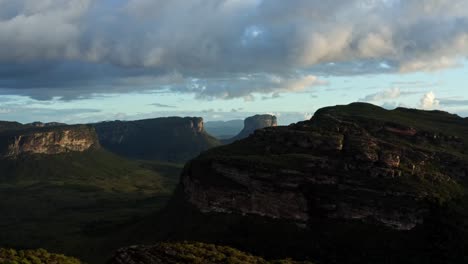 Trucking left flying drone landscape shot of the stunning Capao Valley from the Mount of Pai Inácio in the Chapada Diamantina national park in northern Brazil on a warm sunny summer evening