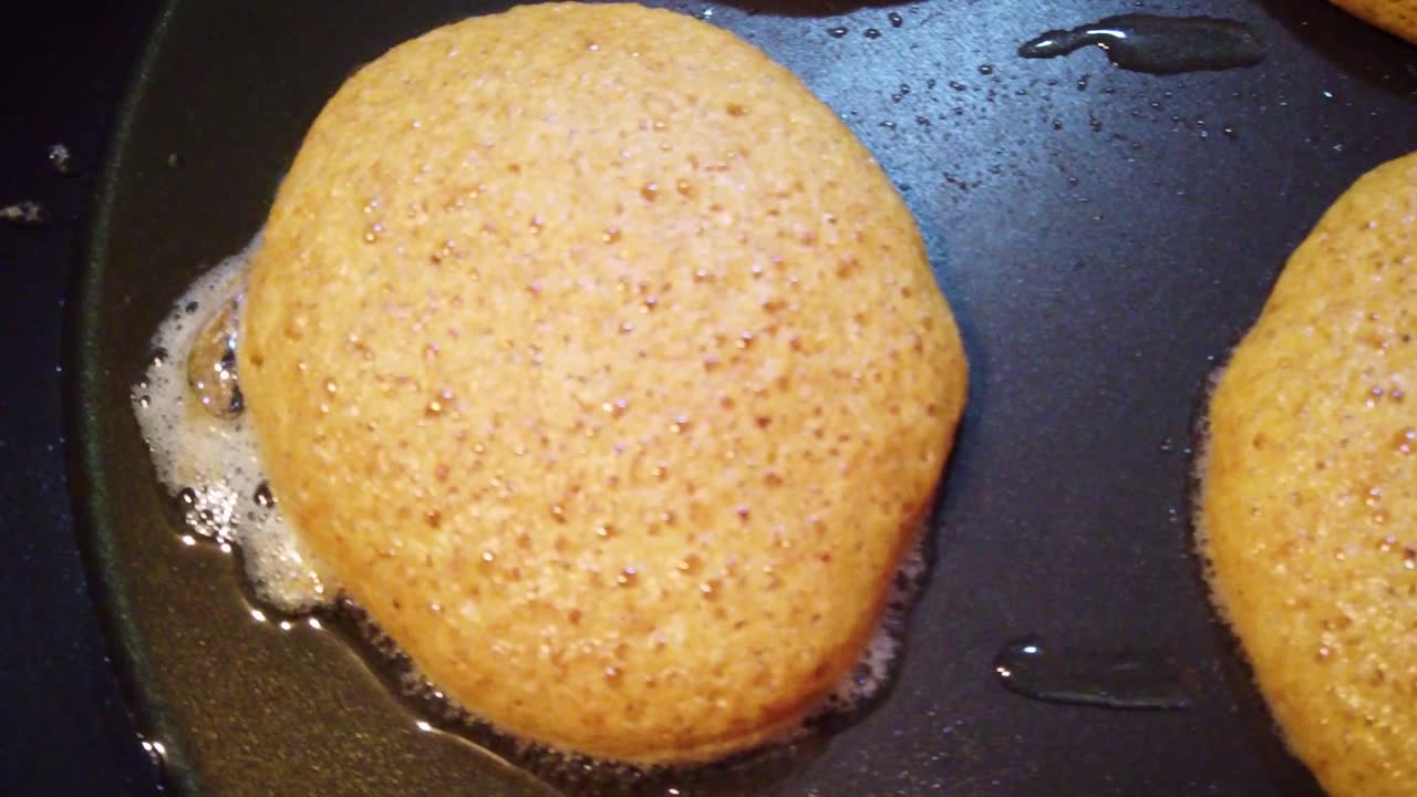 Close-up shot of the cooking process of shrimp cakes, used as a complement to traditional Mexican romeritos