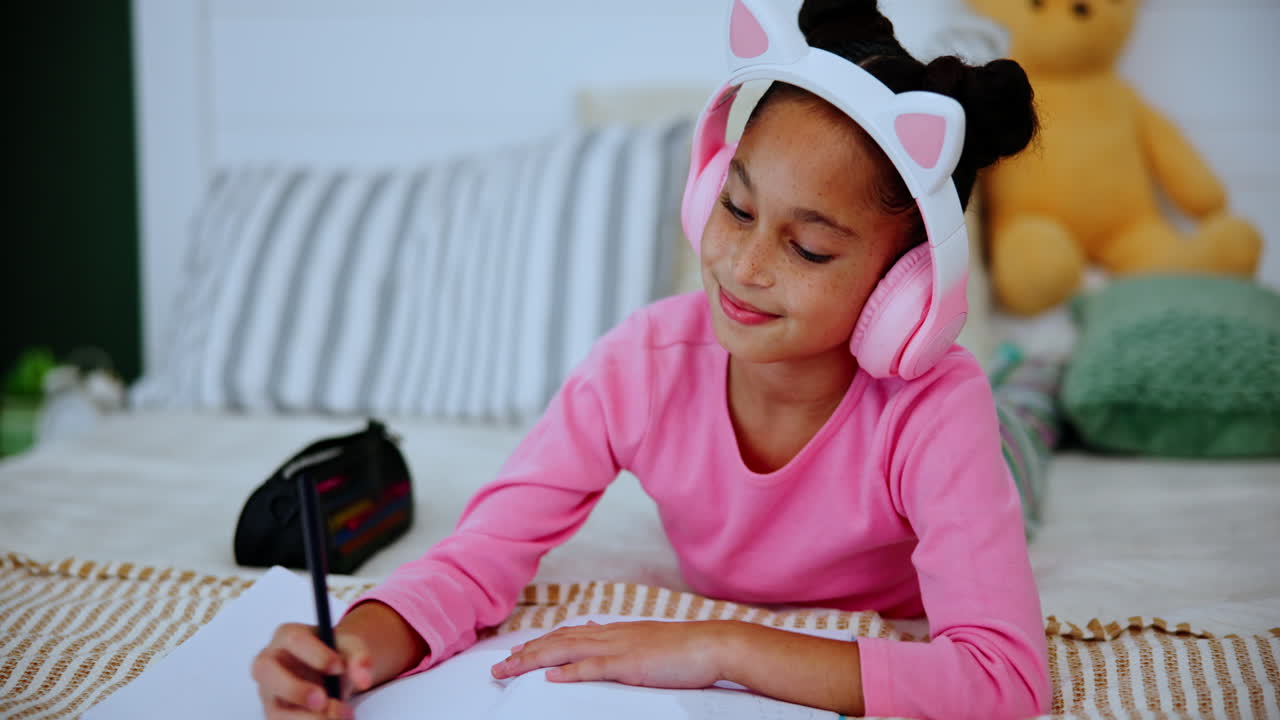 Girl writing in her bedroom