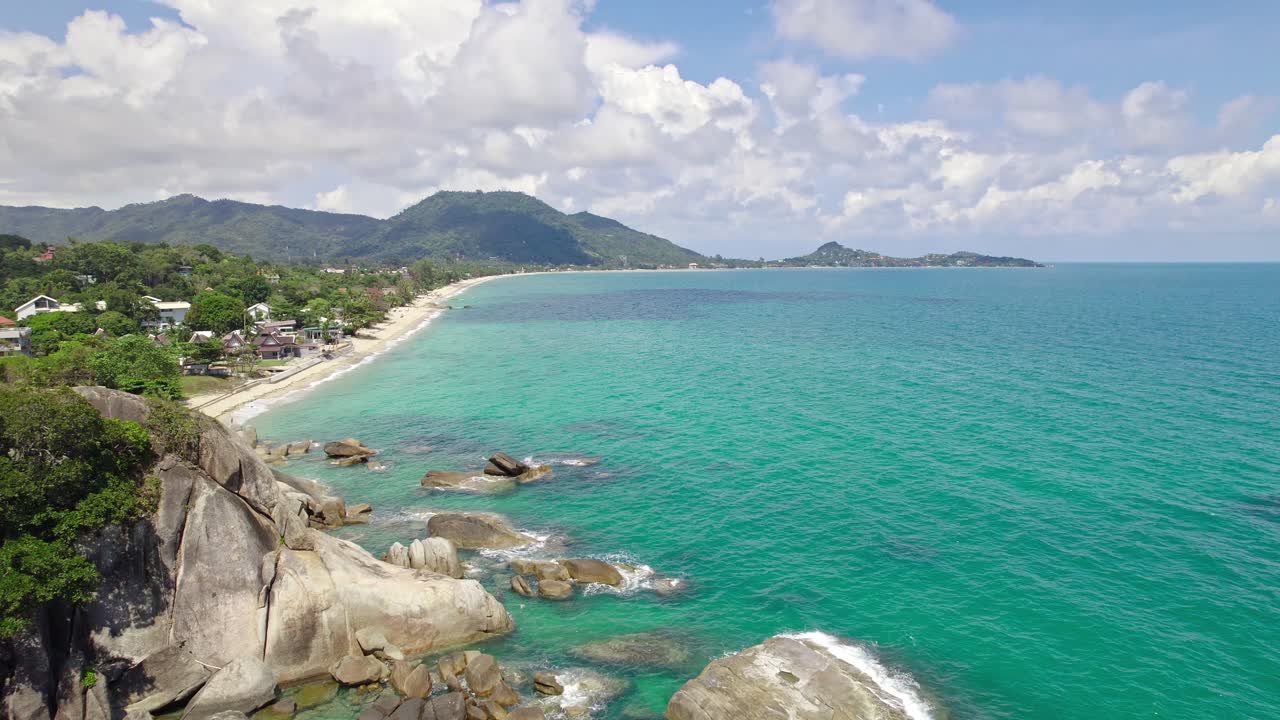 Beautiful 4K drone footage of the beach and unique rock features at Hin Ta Hin Yai Beach on Koh Samui in Thailand