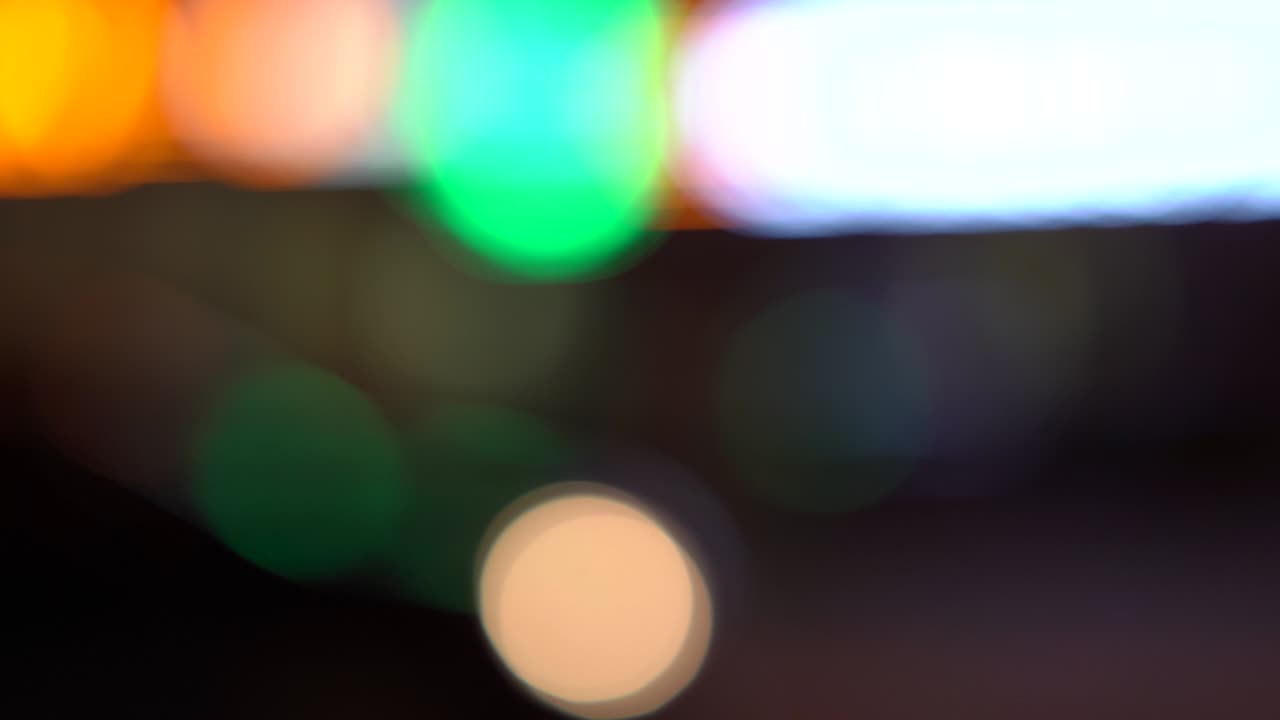 Defocused and blur night city street traffic lights bokeh background.