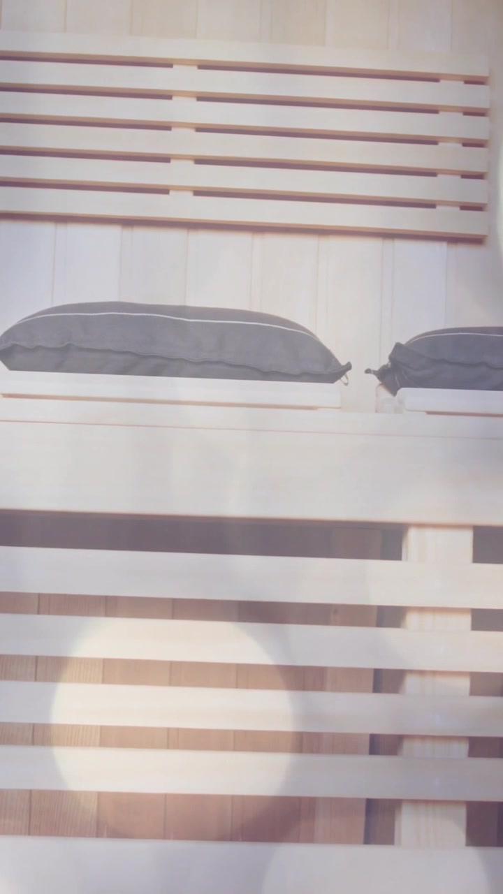 Light bokeh animation over modern wooden interior with decorative pillows