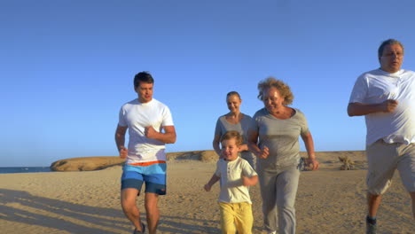 big family jogging on the coast