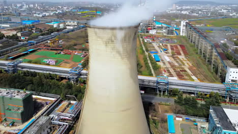 sunrise chemical plant exhaust gas oil emissions, power plant in the city. industrial chimneys from factory metallurgy blue sky metallurgical industrial factory. poisoned air epic pollution of nature.