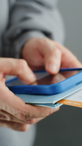 person holding a phone and boarding pass