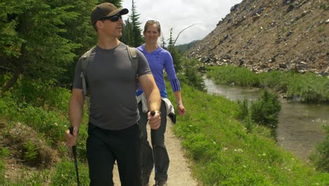 hikers walk past camera