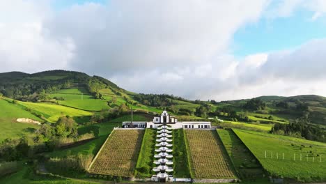 Aerial-fly-Ermida-de-Nossa-Senhora-da-Paz-famous-chapel-at-Azores-Portugal-green-landscape