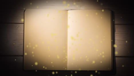 animación de puntos amarillos brillantes sobre el libro abierto con espacio de copia