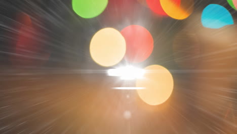 digital animation of colorful bokeh light against bright spot of light on dark background