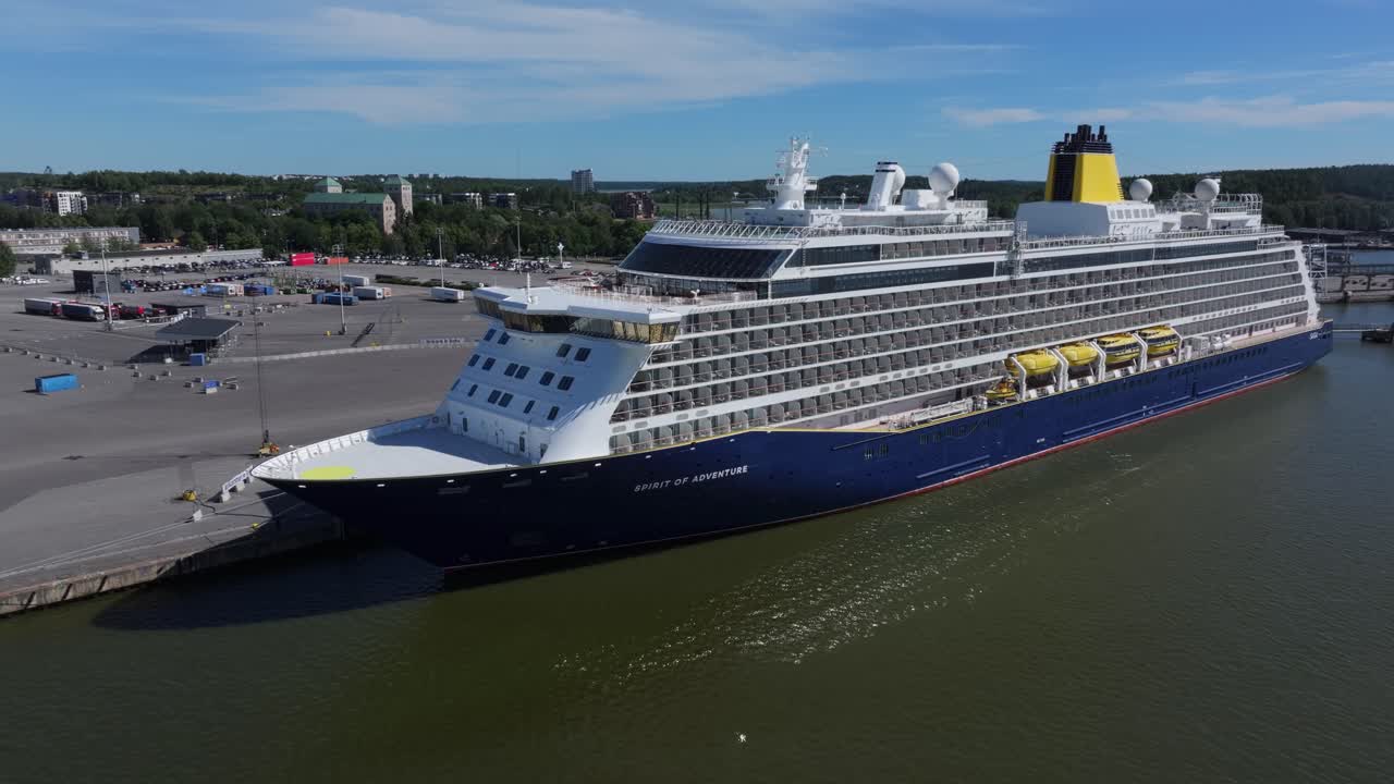 SAGA Cruise ship SPIRIT OF ADVENTURE alongside in port. Turku Castle in background. Low altitude aerial side view.