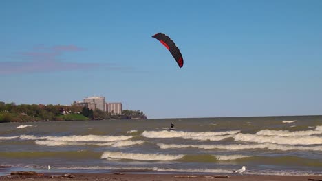 Surfer-off-of-the-coast-of-Lake-Erie-in-Cleveland,-Ohio