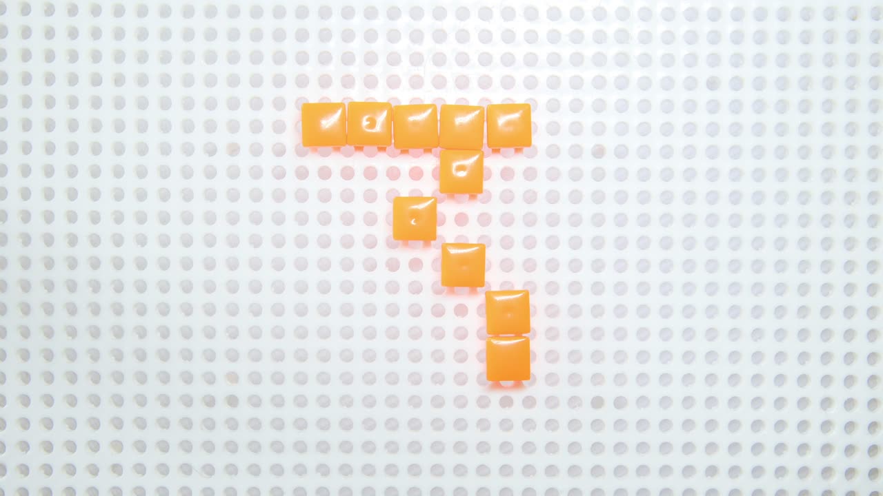 detener el movimiento del número 3 creando un píxel a la vez, hecho con juguetes para niños