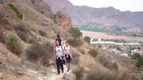 hikers group walk along a rout in the mountain