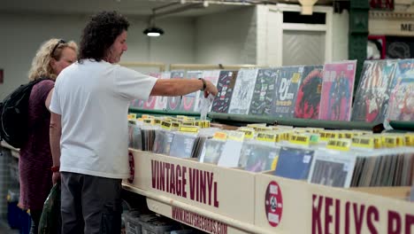 two people browsing records at a vintage shop