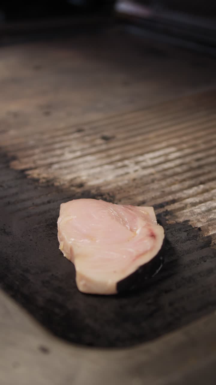 Chef Putting A Slice Of Swordfish On Top Of The Grill