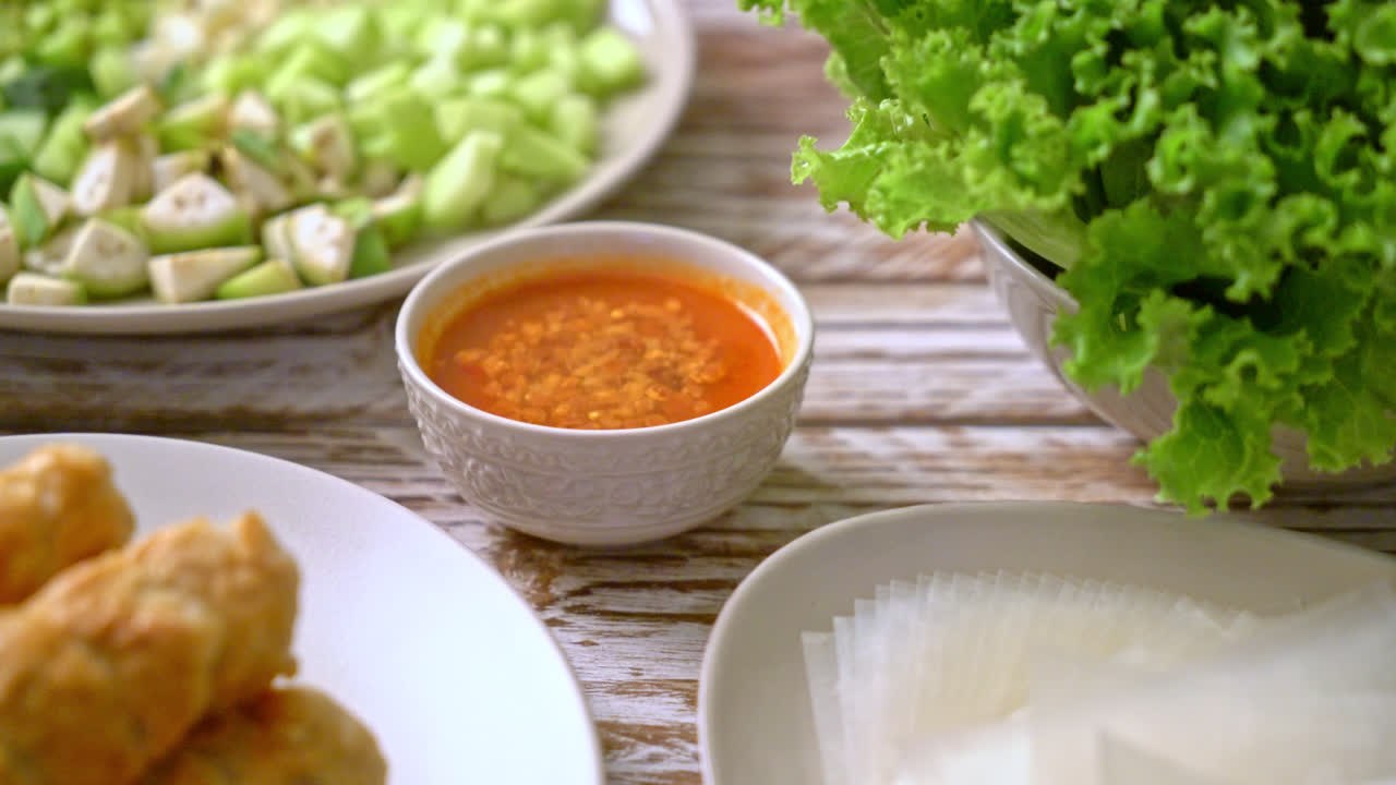 Vietnamese pork meatball with vegetables wraps (Nam-Neaung or Nham Due) - vietnamese traditional food culture