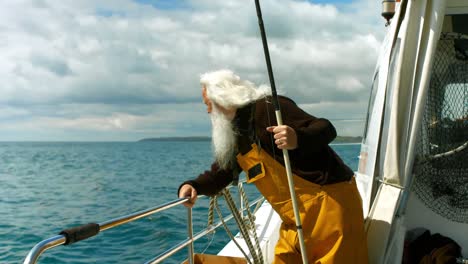 fisherman holding fishing rod