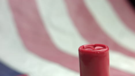 close up of a shotgun shell on american flag background