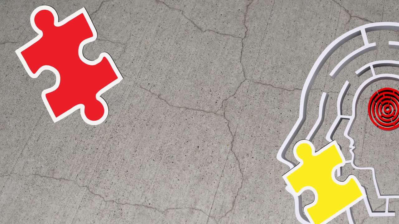 animación de piezas de rompecabezas verdes, amarillas y rojas que caen sobre el modelo de cabeza humana con laberinto