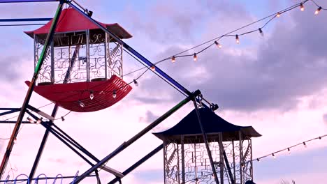 4k shot, ferris wheel in the carnival at dusk.