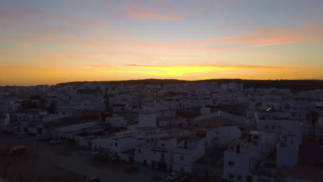 aerial ascending shot during the  twilight over the town of barbate in the south of spain.