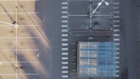 Aerial-top-down,-empty-deserted-parking-lot-during-pandemic-lockdown