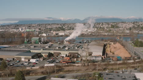 aerial view of industry along the fraser river in richmond, greater vancouver