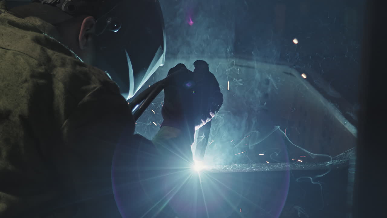 Unrecognizable Welder Man Working With Iron