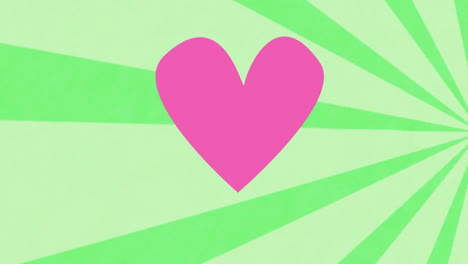 pink heart animation over green radial background