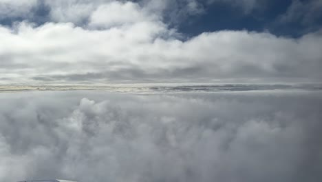 spectacular aerial views of a commercial airplane flying between two layers of clouds